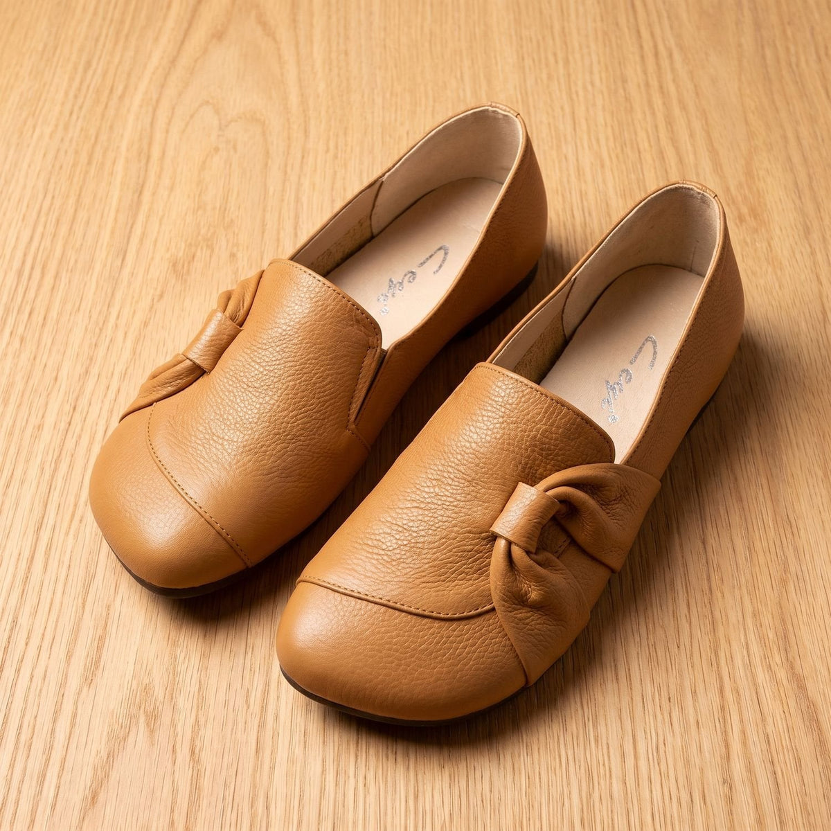 Ortopædiske slip-on-ballerinaer i læder til kvinder med sløjfedetalje